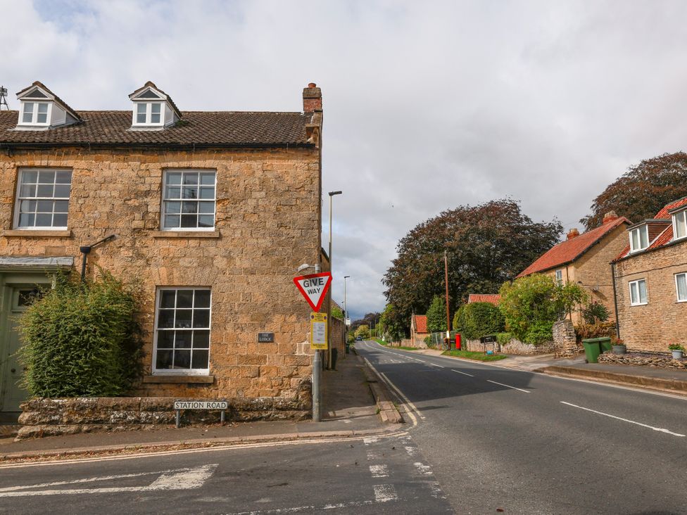 A street scene with a building and traffic sign at The Lodge Snainton near Scarborough