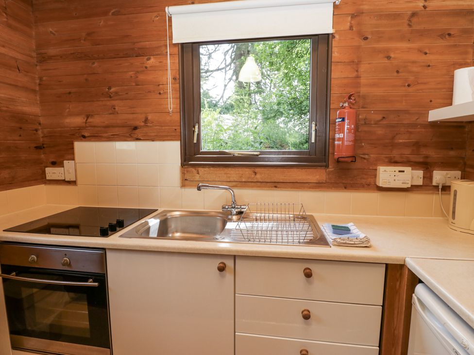 A kitchen with a sink and stove at Buttermere in Spark Bridge near Greenodd