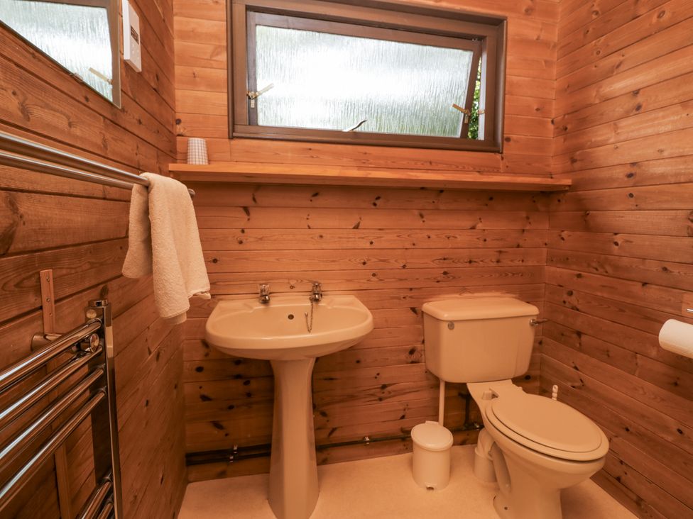 A bathroom with a sink and toilet at Buttermere Spark Bridge near Greenodd