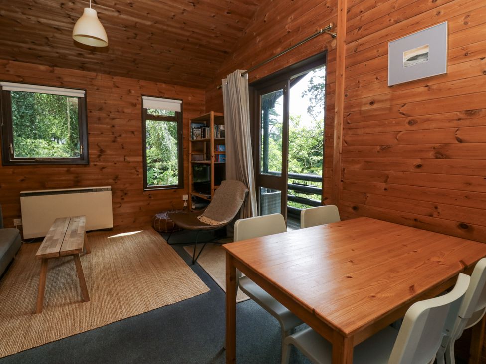 A living room with a sofa and a table at Grasmere Spark Bridge near Greenodd