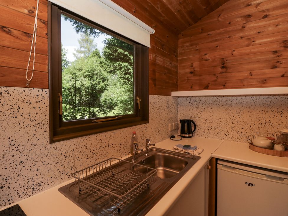 A kitchen with a window and sink at Grasmere in Spark Bridge near Greenodd