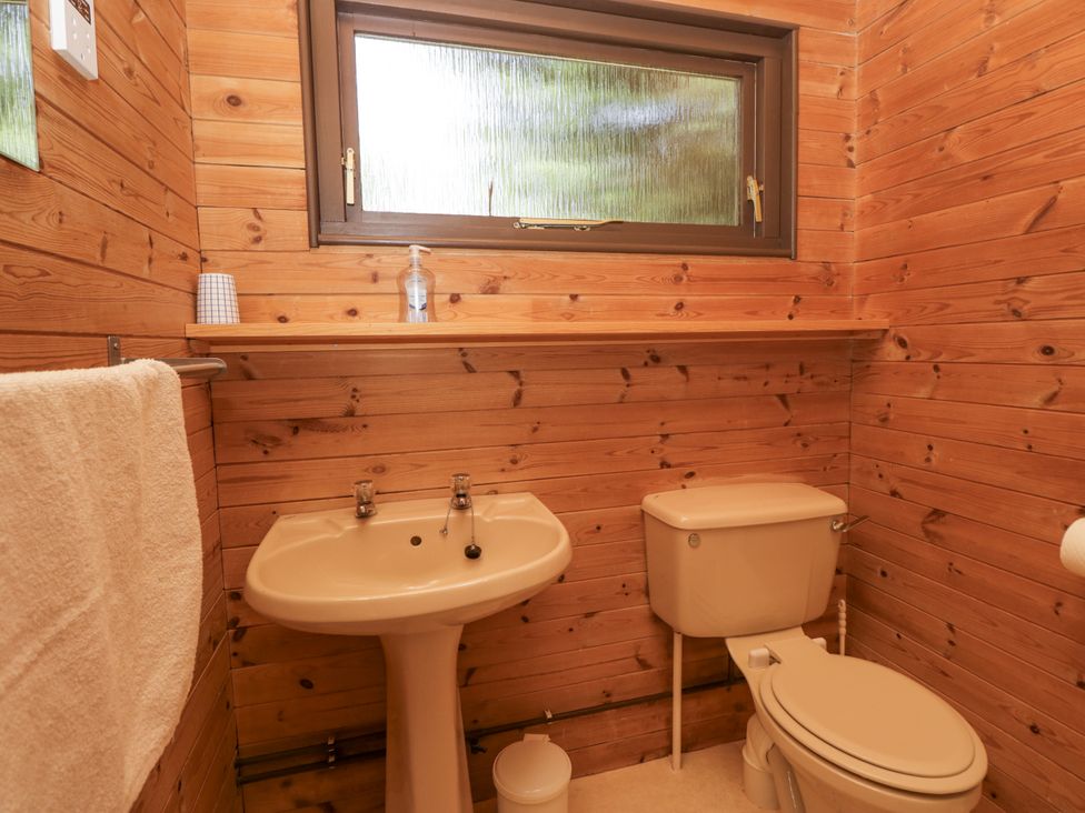 A bathroom with a sink and toilet at Grasmere, Spark Bridge near Greenodd