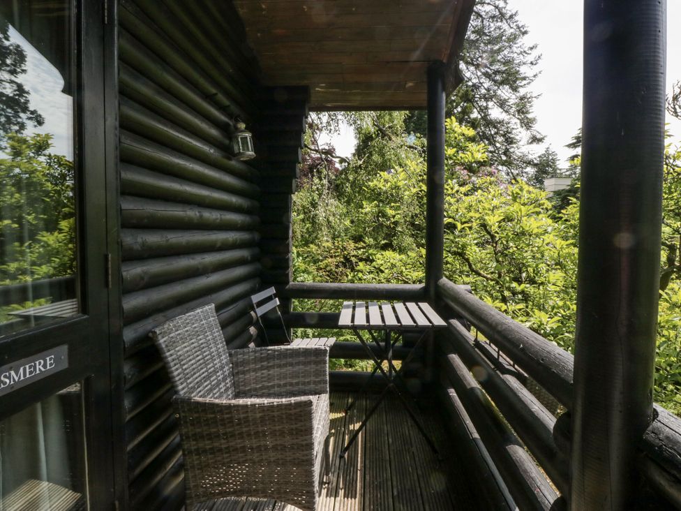 A balcony with table and chairs at Grasmere near Spark Bridge