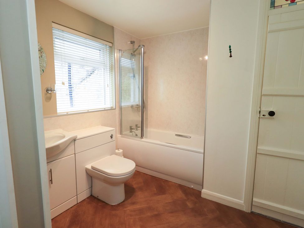A bathroom with a bathtub and sink at Back Cottage in Kirkby Lonsdale