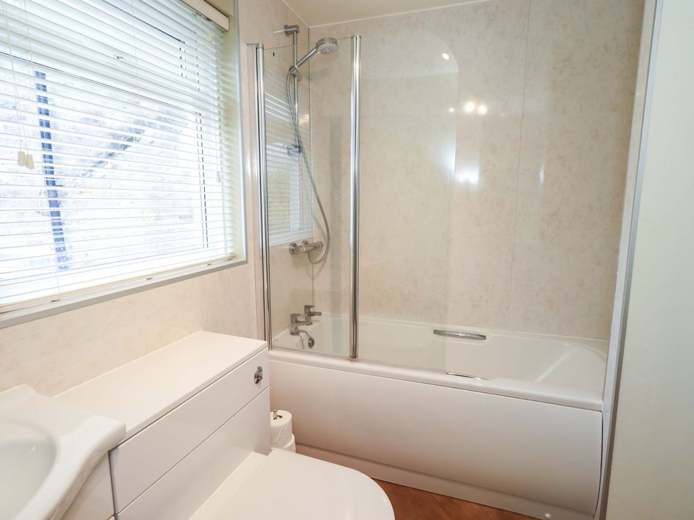 A bathroom with a bathtub and shower at Back Cottage in Kirkby Lonsdale