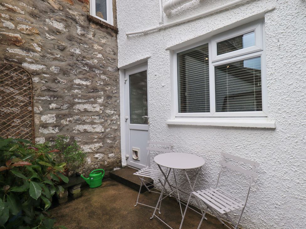 An outdoor area with a table and chairs at Back Cottage in Kirkby Lonsdale