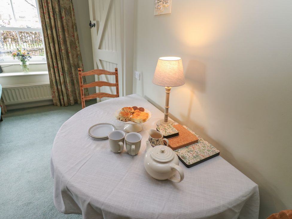 A dining room with a table set for tea at Bill's Place in Bainbridge near Hawes