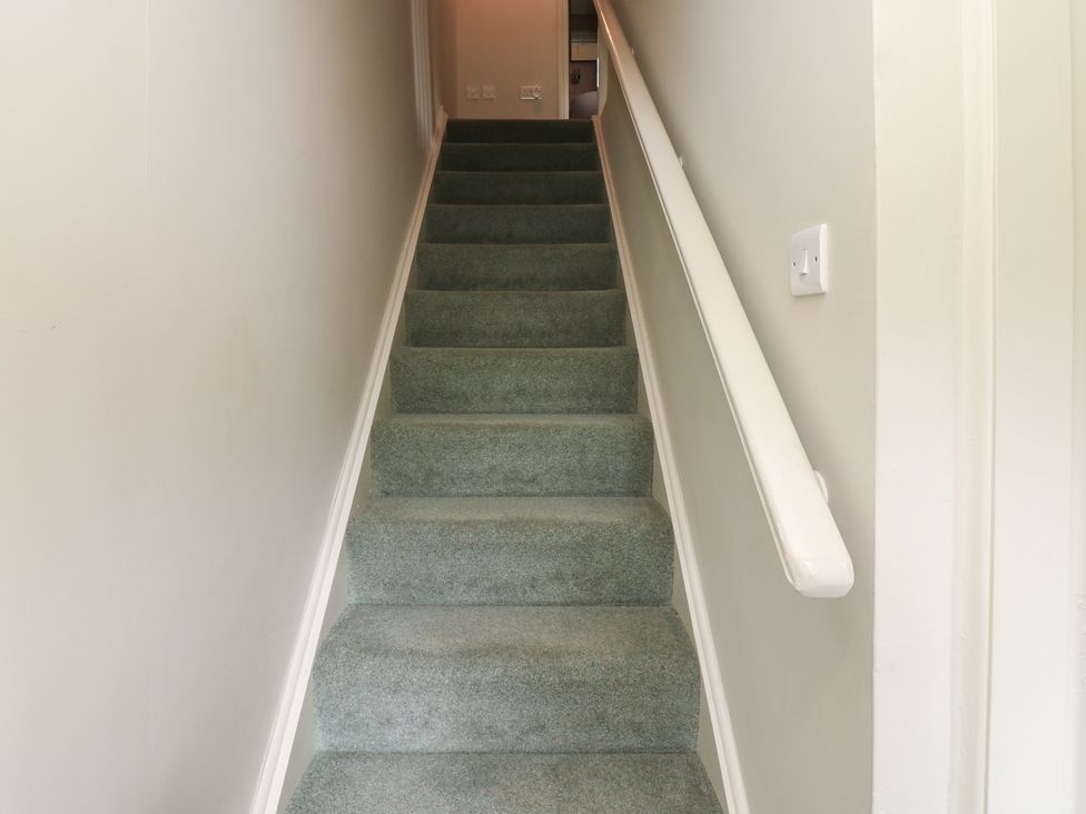 A staircase leading to the upper level at Bill's Place in Bainbridge near Hawes