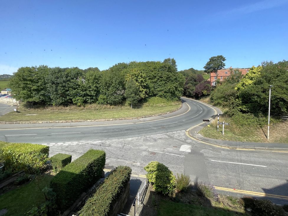 A view of a road and trees at Sterling House in Robin Hood's Bay
