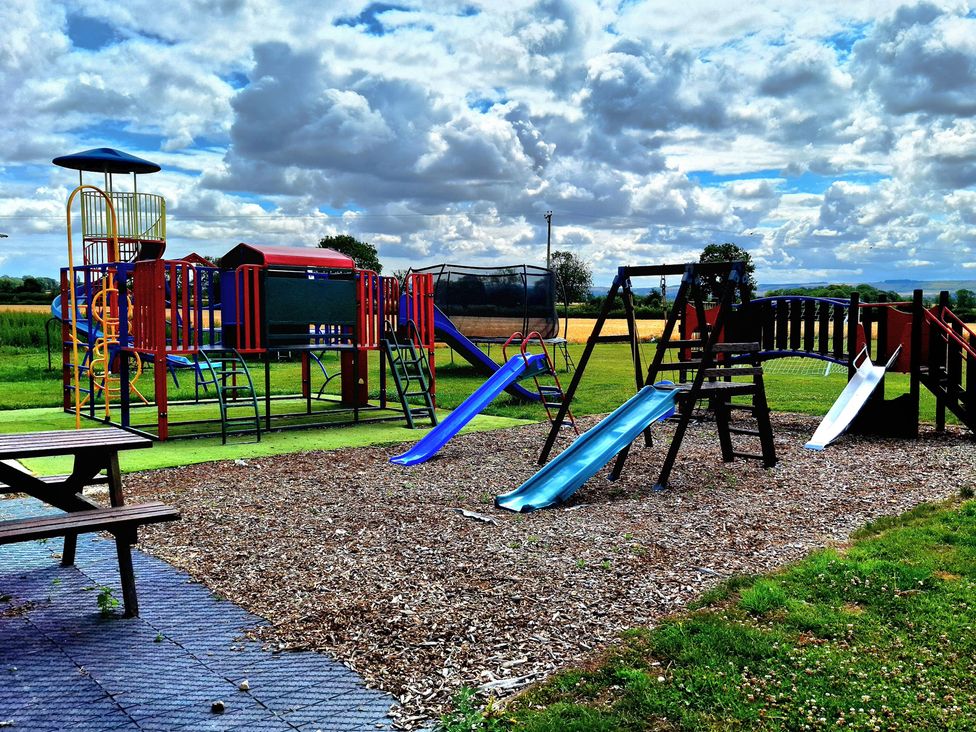 A playground with slides and swings at Boundcliffe Farm in Allerston near Pickering