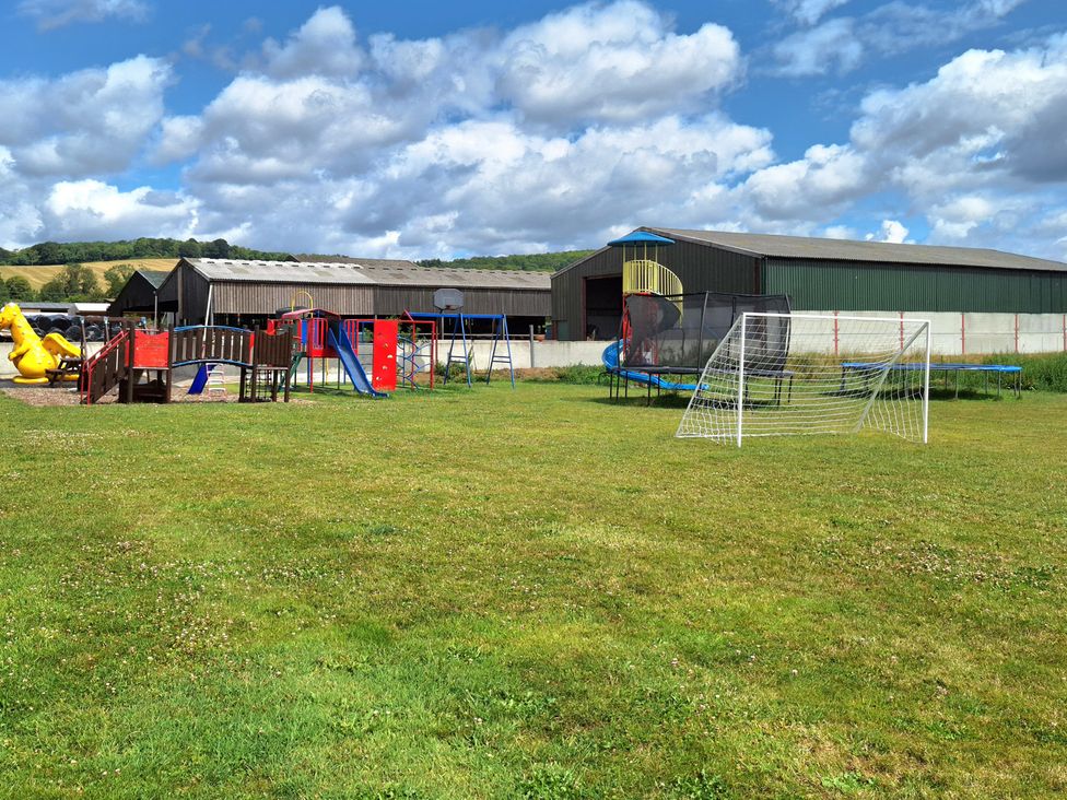 An outdoor playground with a slide and trampoline at Boundcliffe Farm in Allerston near Pickering