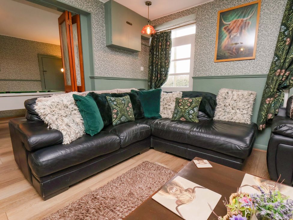 A living room with a sofa and cushions at Boundcliffe Farm Allerston near Pickering