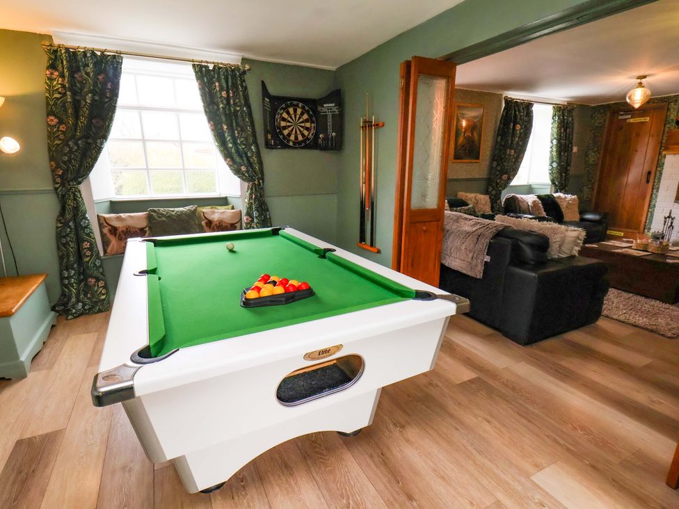 A snug with a pool table and dartboard at Boundcliffe Farm in Allerston near Pickering