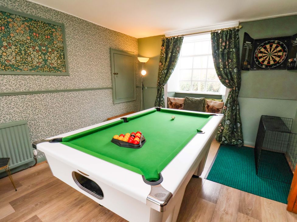 A snug with a pool table and dartboard at Boundcliffe Farm in Allerston near Pickering