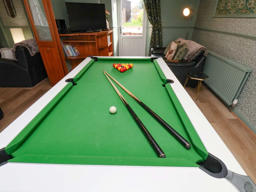 A pool table with cue sticks at Boundcliffe Farm Allerston near Pickering
