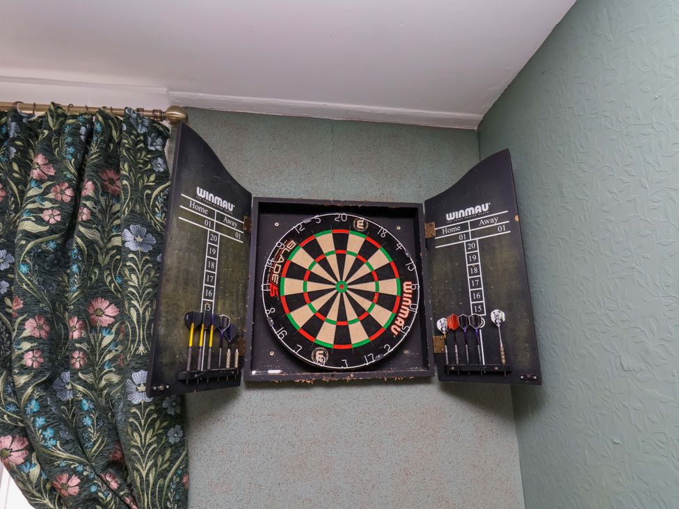 A dartboard and scoreboards mounted on the wall at Boundcliffe Farm in Allerston near Pickering