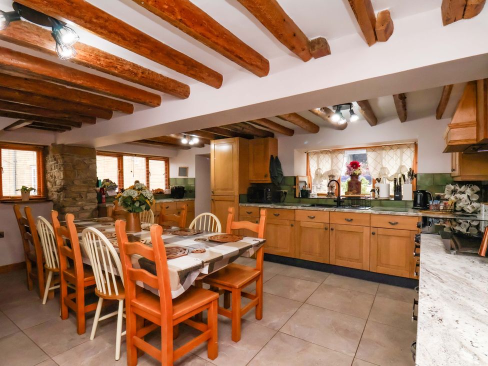 A kitchen with a dining table and chairs at Boundcliffe Farm in Allerston near Pickering