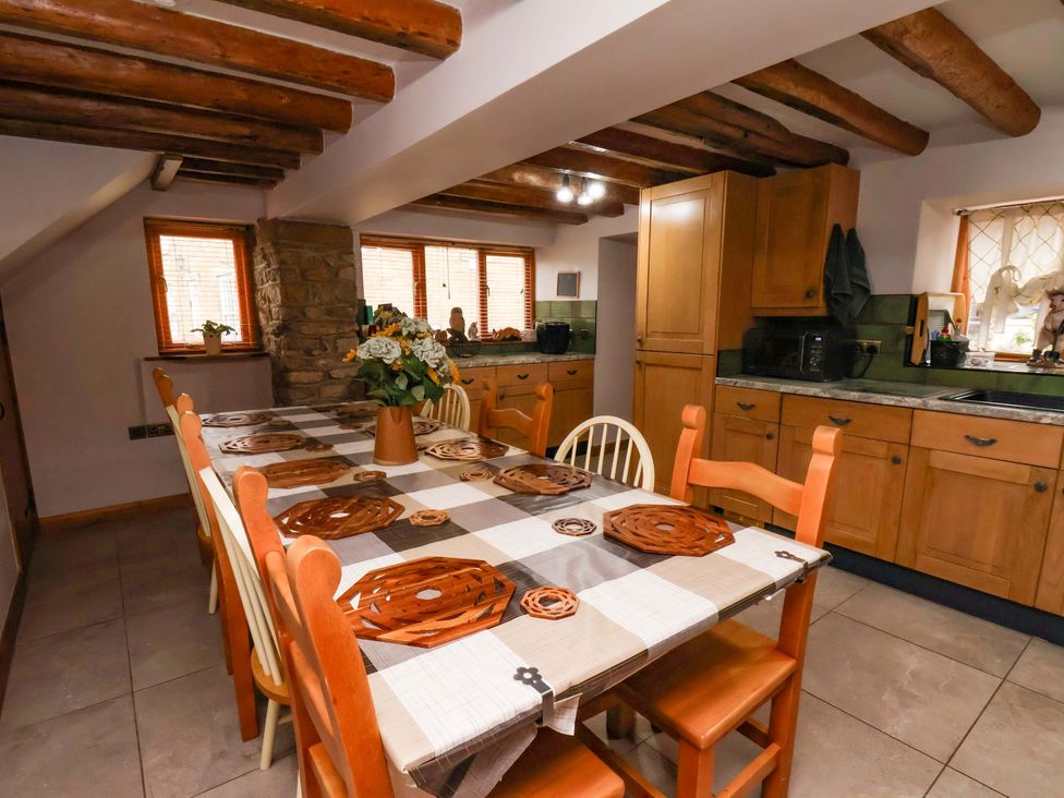A kitchen with a dining table and chairs at Boundcliffe Farm in Allerston near Pickering