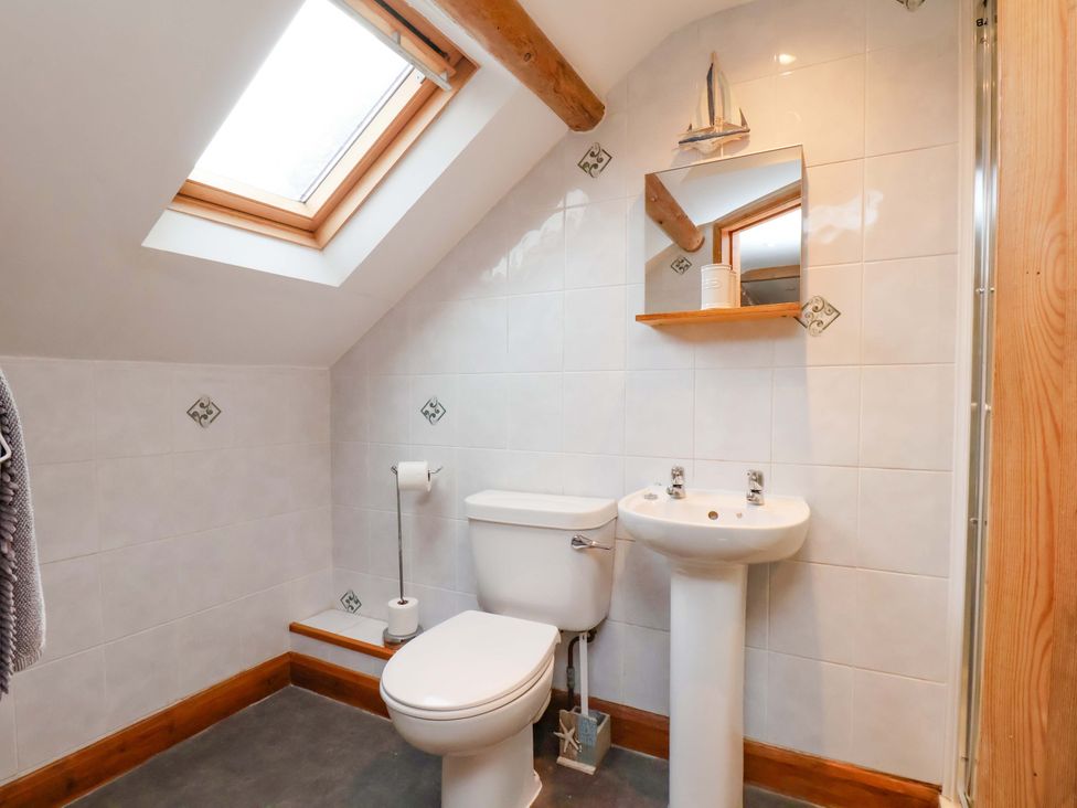 A bathroom with a toilet and sink at Boundcliffe Farm in Allerston near Pickering