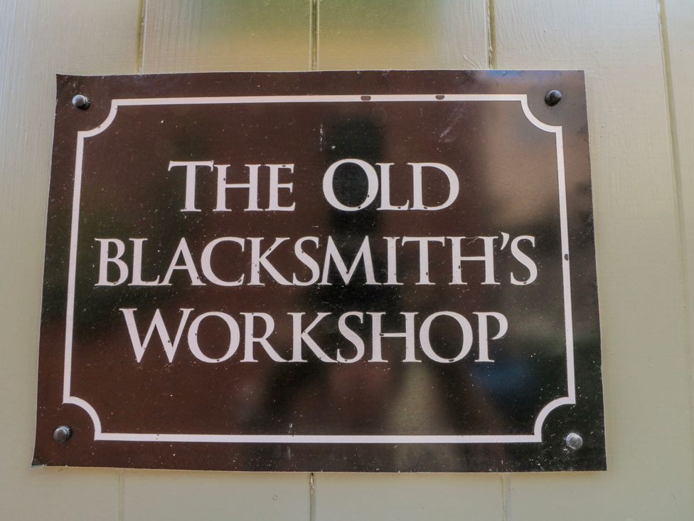 A sign for The Old Blacksmith's Workshop in Whitby