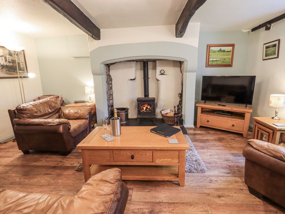 A living room with a fireplace and seating arrangement at Harber Scar Horton-in-Ribblesdale near Settle