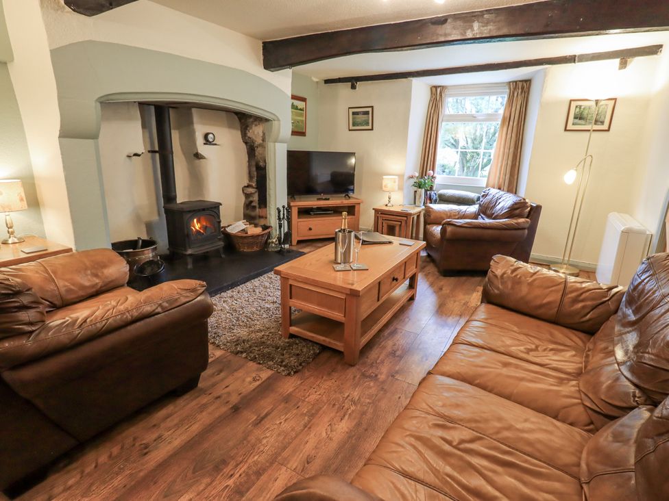 A living room with a sofa and coffee table at Harber Scar in Horton-in-Ribblesdale near Settle