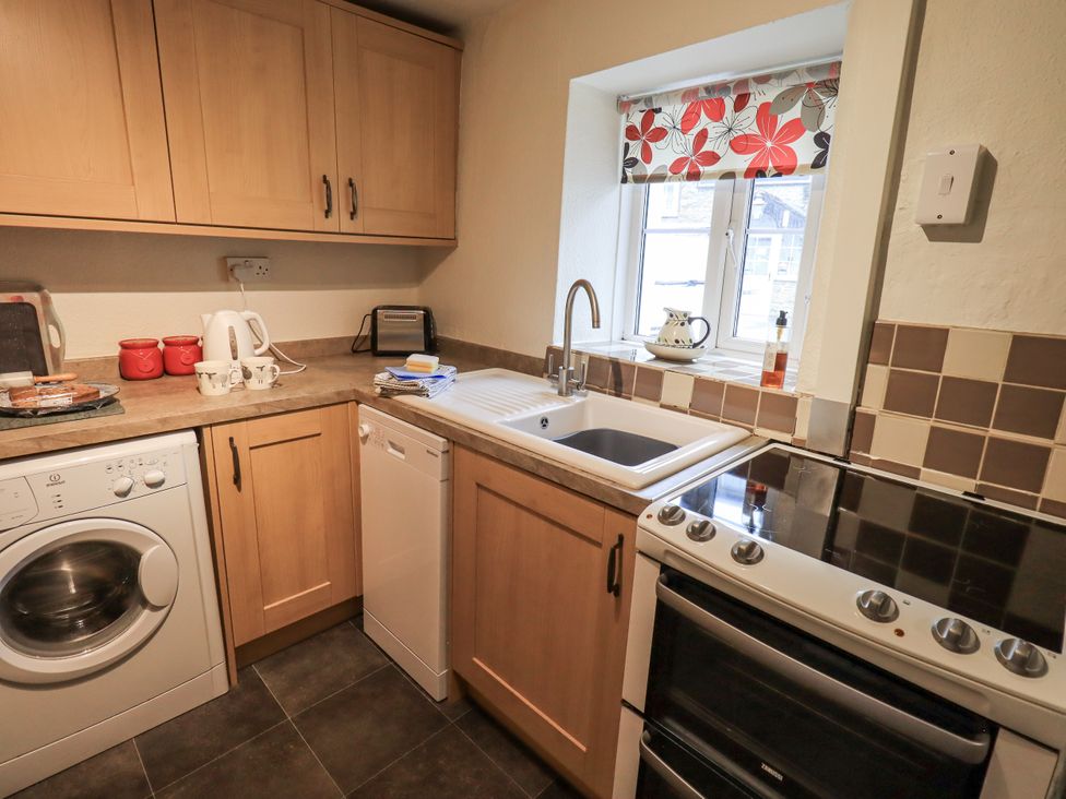 A kitchen with appliances and cabinets at Harber Scar in Horton-in-Ribblesdale near Settle