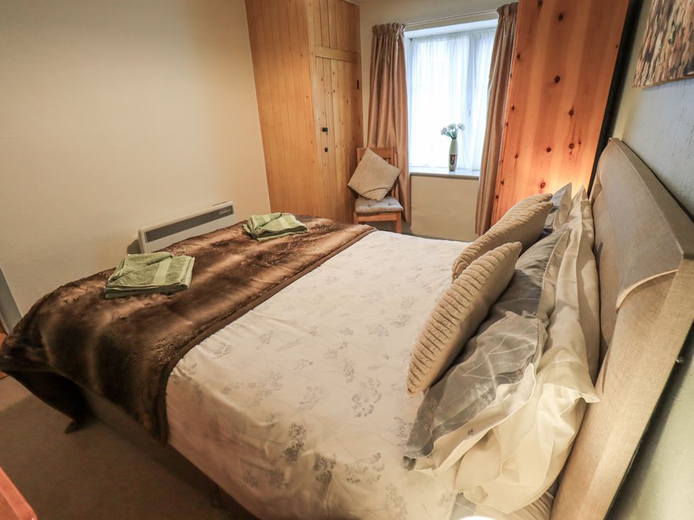 A bedroom with a bed and towels at Harber Scar in Horton-in-Ribblesdale near Settle