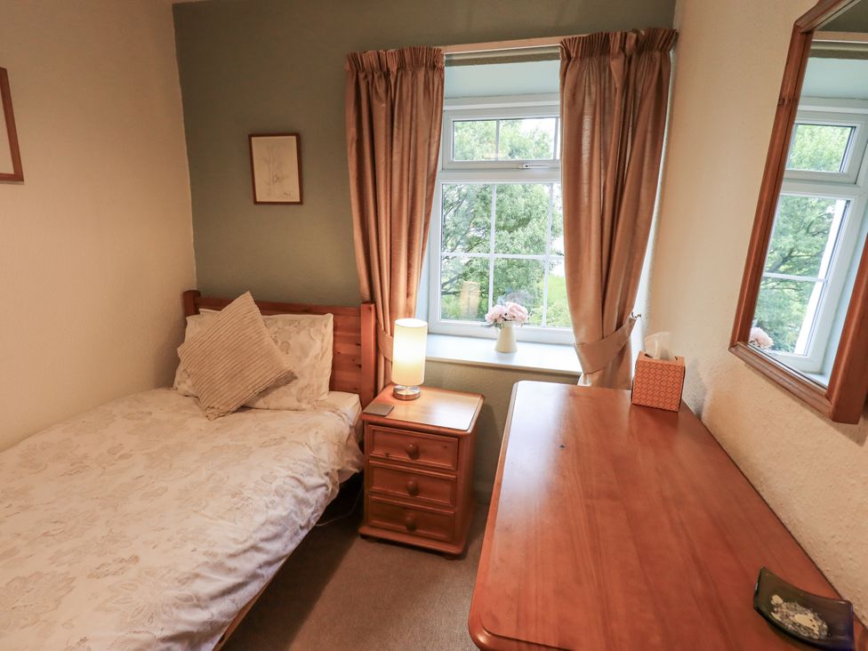 A bedroom with a bed and table at Harber Scar in Horton-in-Ribblesdale near Settle