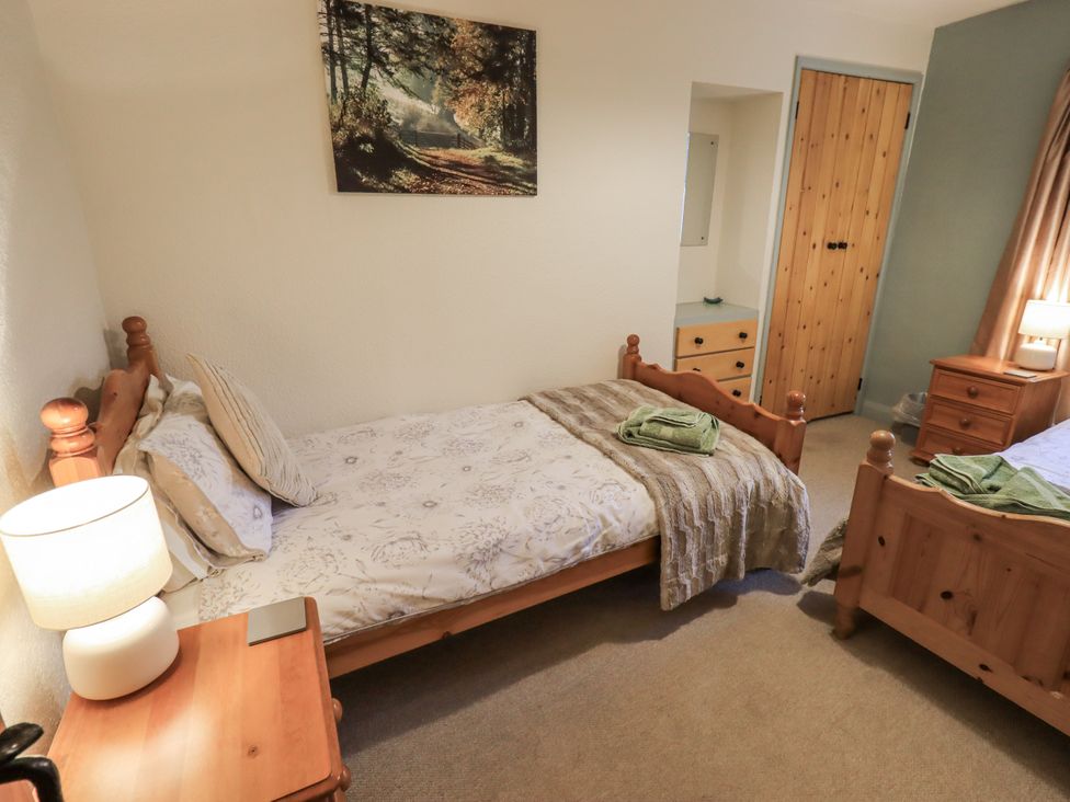 A bedroom with two beds and a lamp at Harber Scar Horton-in-Ribblesdale near Settle