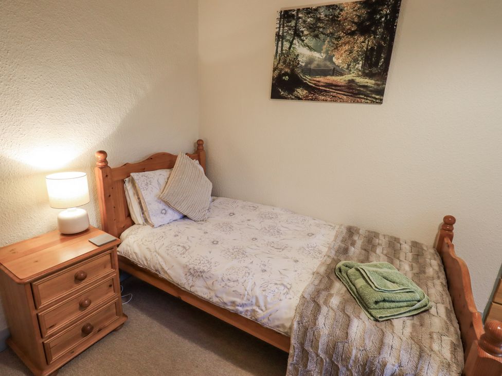 A bedroom with a single bed and nightstand at Harber Scar Horton-in-Ribblesdale near Settle