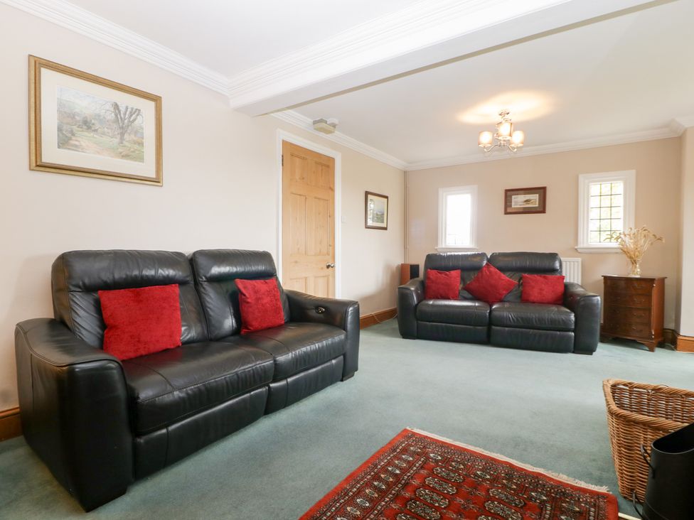 A living room with two sofas and a painting at The Croft in Vowchurch near Peterchurch