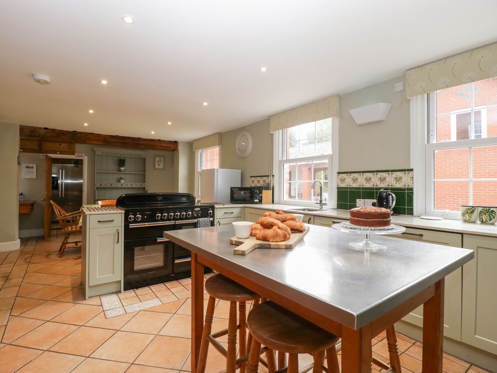 A kitchen with an oven and a table with baked goods at The Croft in Vowchurch near Peterchurch