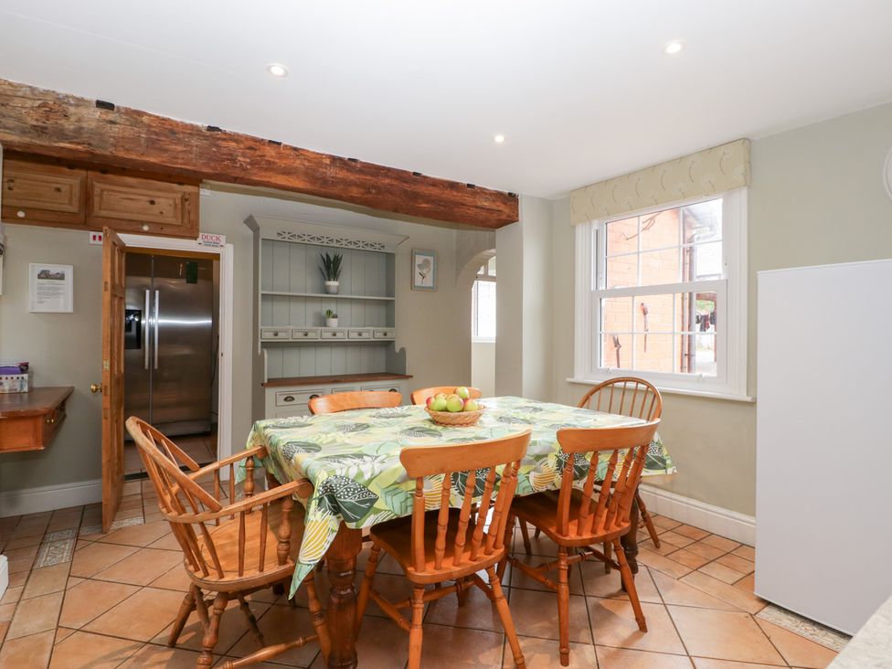 A kitchen with a dining table and chairs at The Croft in Vowchurch near Peterchurch