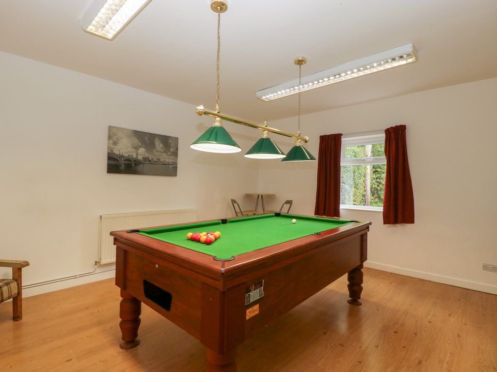 A games room with a pool table and a window at The Croft in Vowchurch near Peterchurch