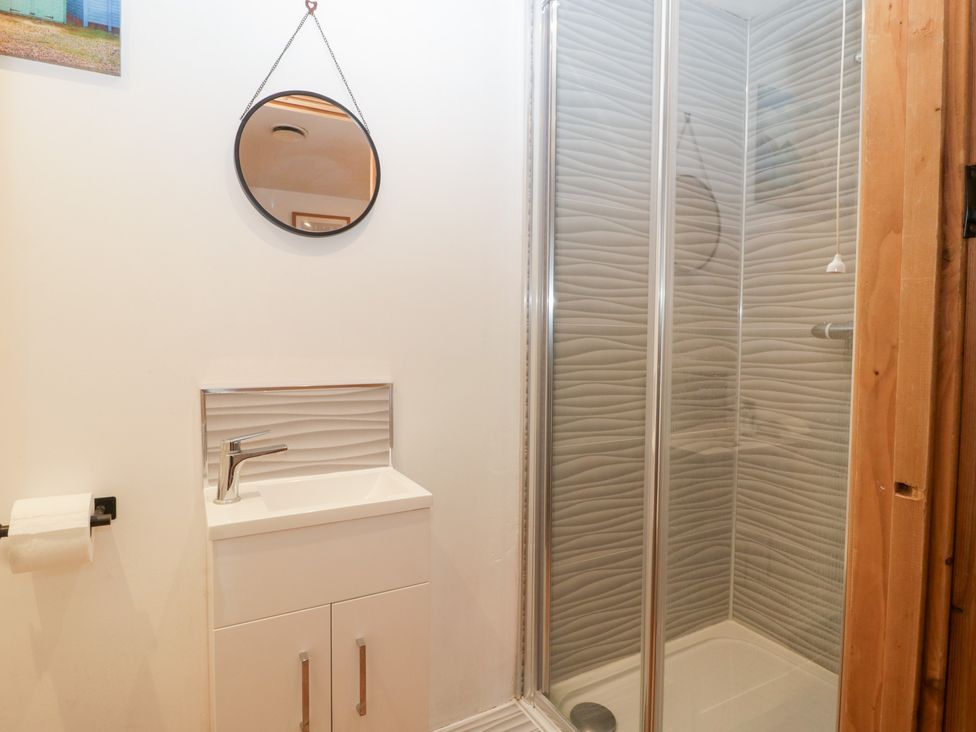 A bathroom with a shower and sink at The Croft in Vowchurch near Peterchurch