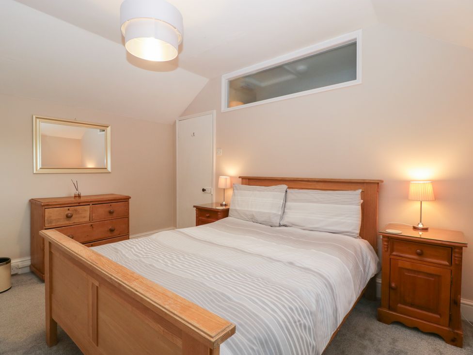 A bedroom with a bed and dresser at The Croft in Vowchurch near Peterchurch