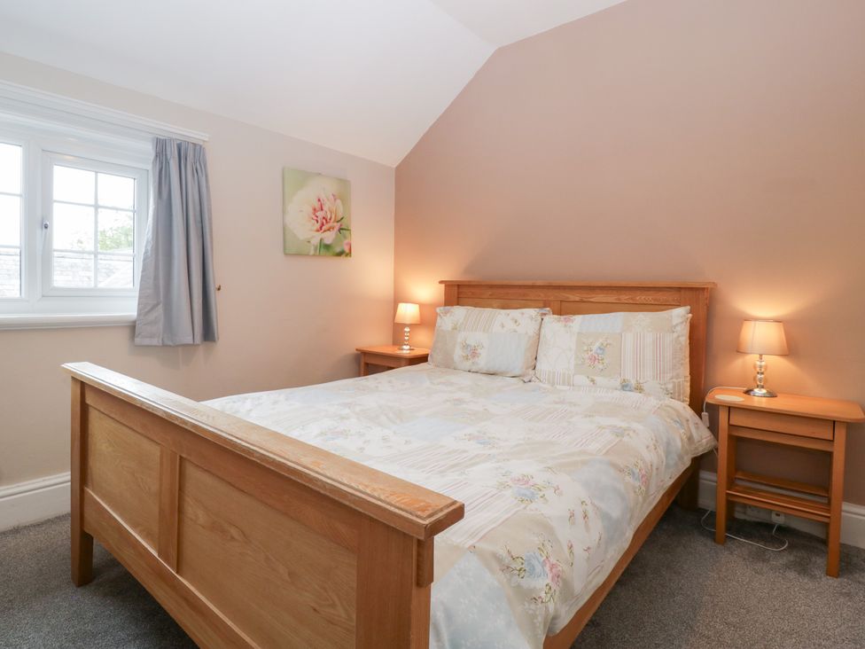 A bedroom with a bed and nightstands at The Croft in Vowchurch near Peterchurch
