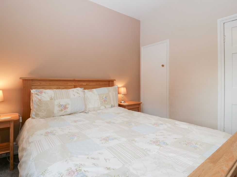 A bedroom with a bed and bedside tables at The Croft in Vowchurch near Peterchurch