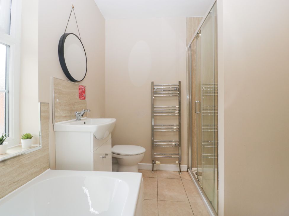 A bathroom with a sink, shower and bathtub at The Croft in Vowchurch near Peterchurch