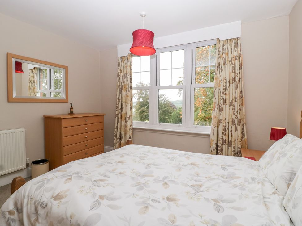 A bedroom with a bed and dresser at The Croft in Vowchurch near Peterchurch