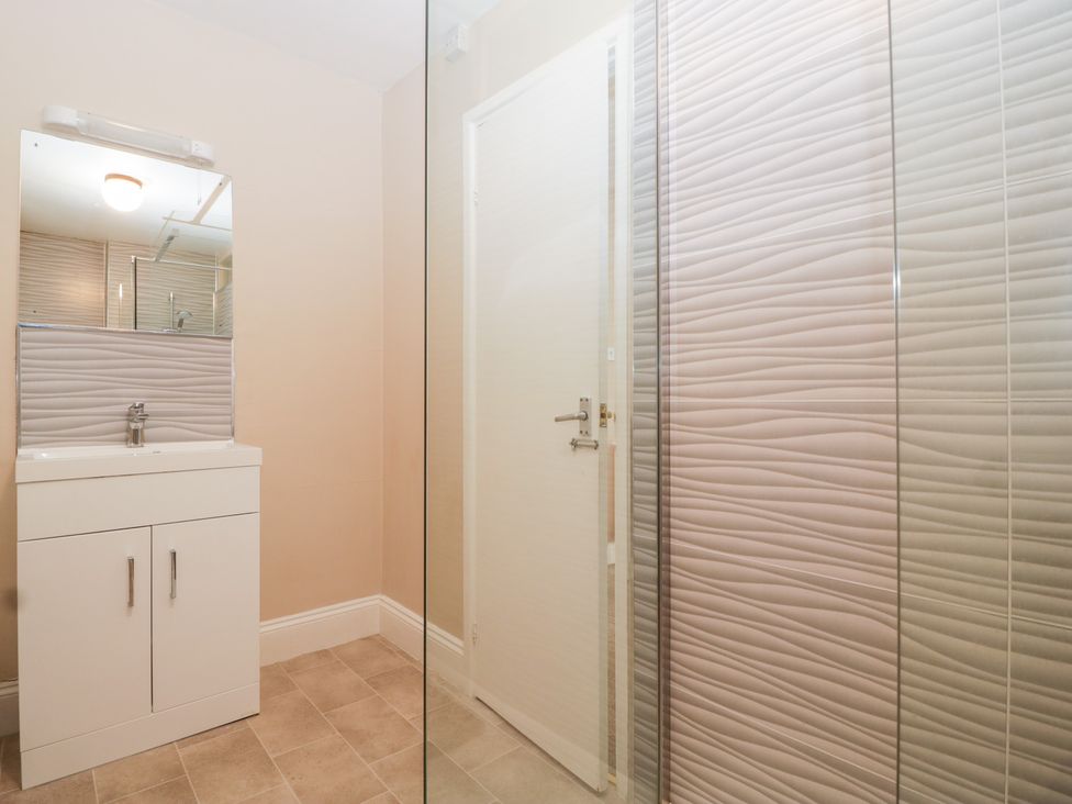 A bathroom with a sink and mirror at The Croft in Vowchurch near Peterchurch