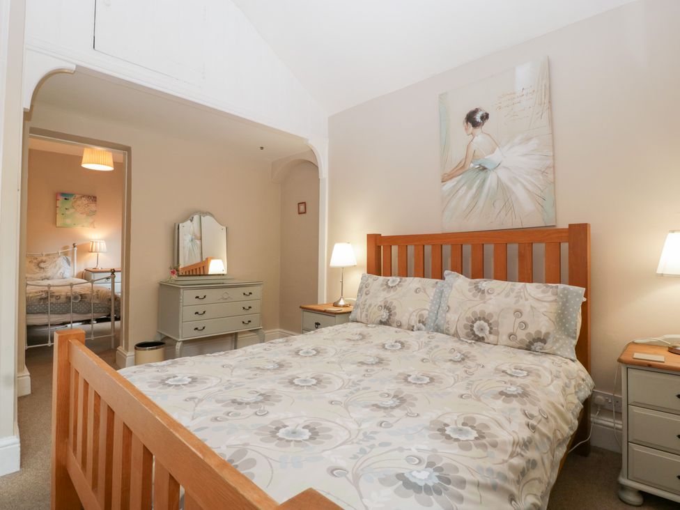 A bedroom with a bed and nightstand at The Croft in Vowchurch near Peterchurch