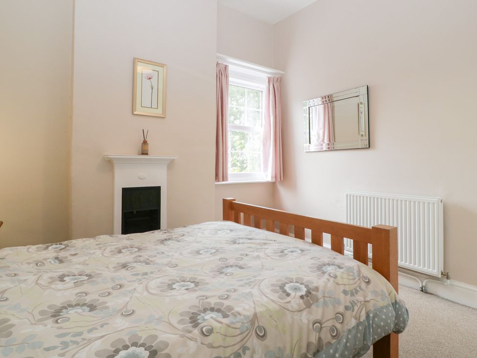 A bedroom with a bed and window at The Croft in Vowchurch near Peterchurch