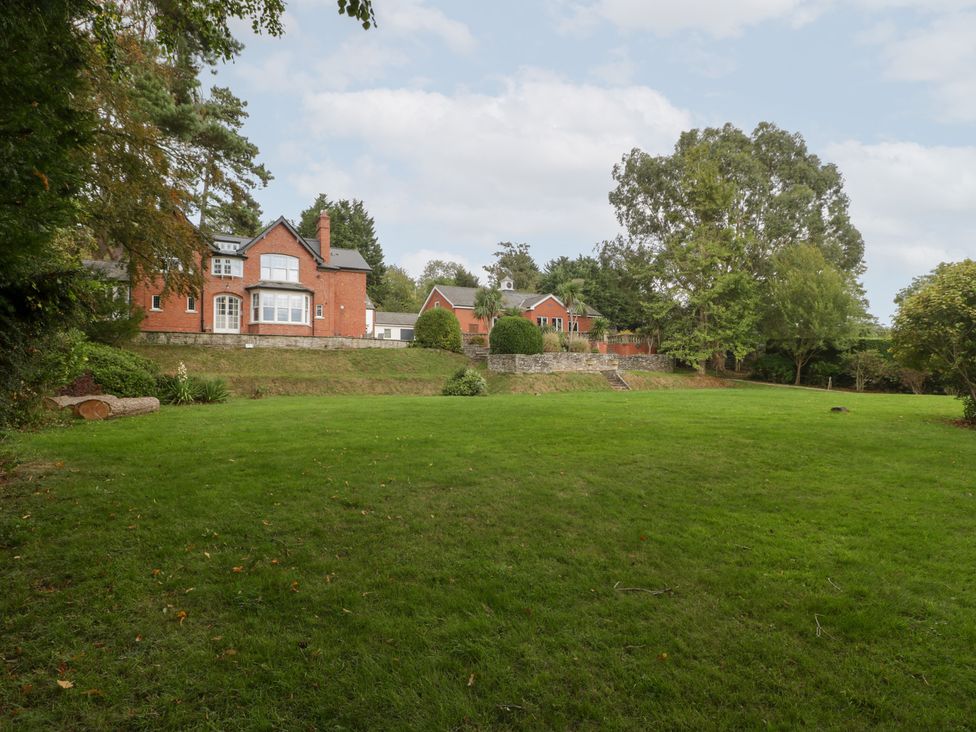 A garden with a view of multiple houses at The Croft in Vowchurch near Peterchurch