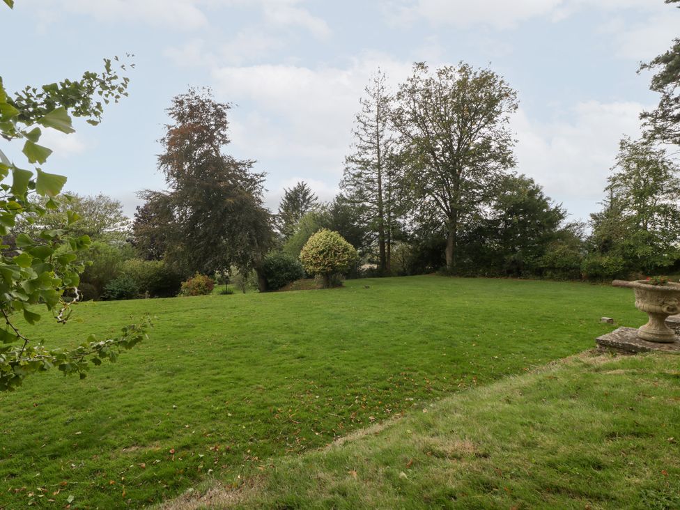 A garden with trees and grass at The Croft in Vowchurch near Peterchurch
