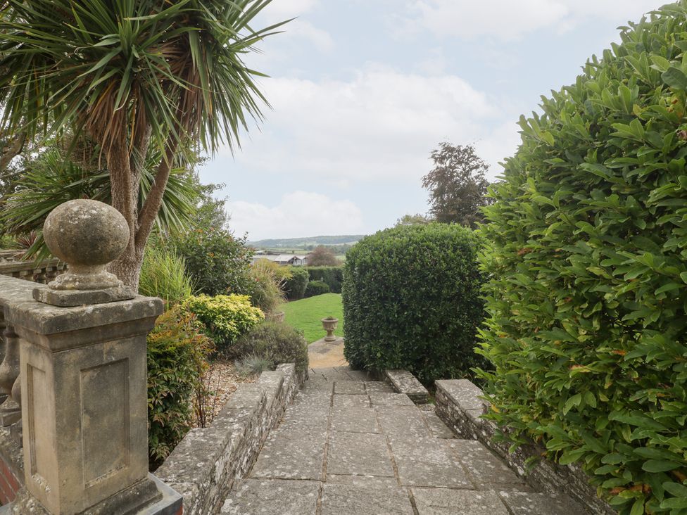 A garden pathway leading to a lawn area at The Croft in Vowchurch near Peterchurch