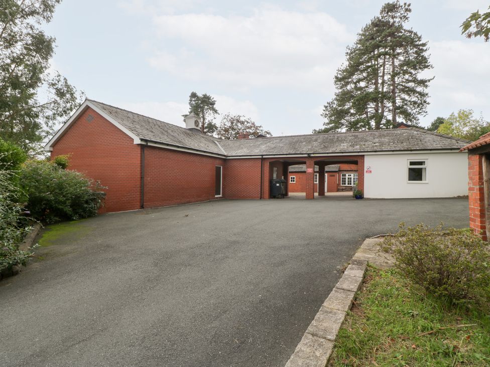 A building with a driveway and trees at The Croft in Vowchurch near Peterchurch