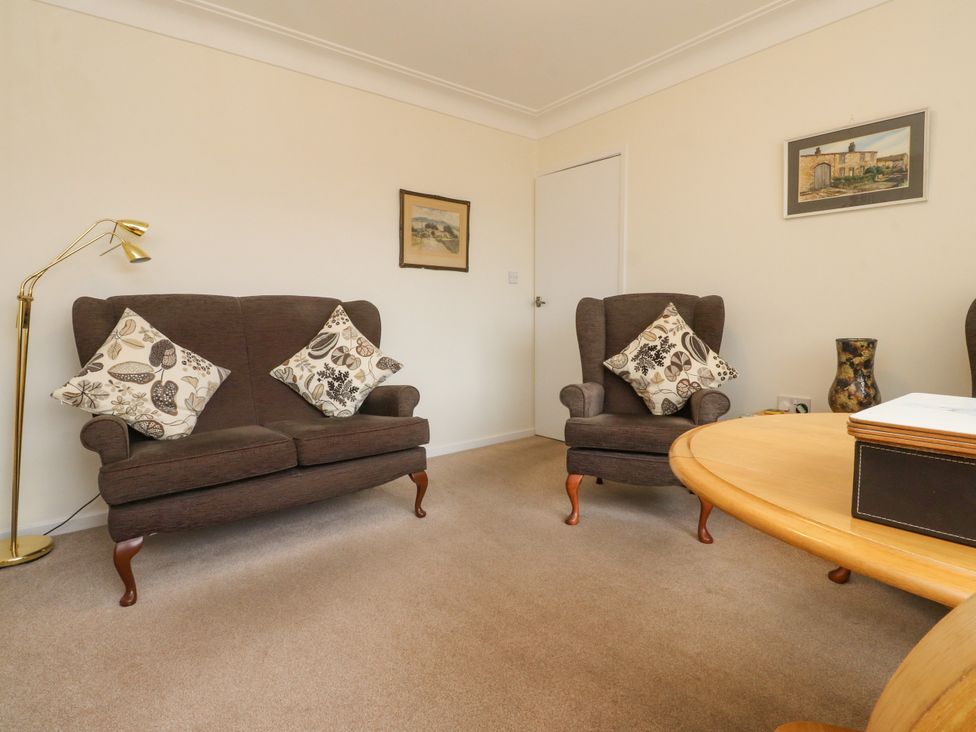 A living room with two armchairs and a coffee table at Wynnville in Embsay near Skipton
