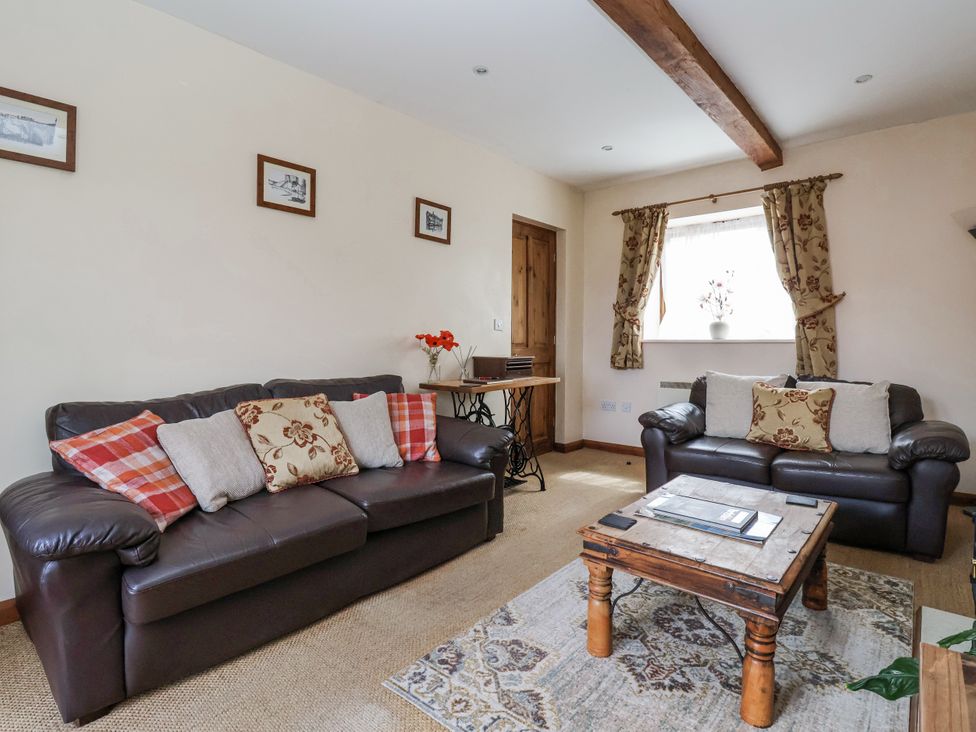 A living room with sofas and a coffee table at Croft Granary in Stillington near Easingwold and York